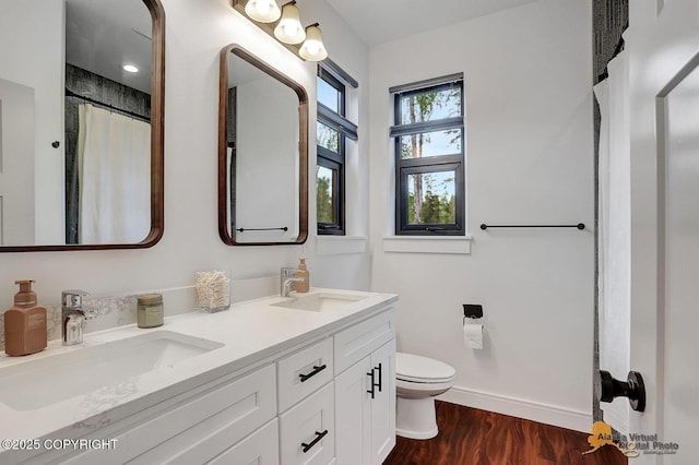 4576 S Gon Fishin Dr, Wasilla, AK 99623 - bathroom with wood finished floors, double vanity, and a shower with shower curtain