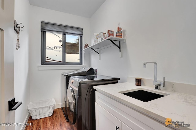 4576 S Gon Fishin Dr, Wasilla, AK 99623 - washroom with independent washer and dryer, cabinet space, and dark wood-style flooring
