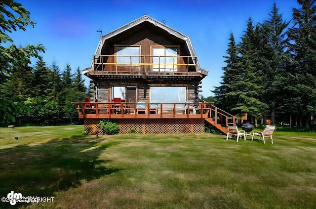 21033 Sterling Hwy, Ninilchik, AK 99639 - back of house featuring a yard, a wooden deck, a balcony, and stairs