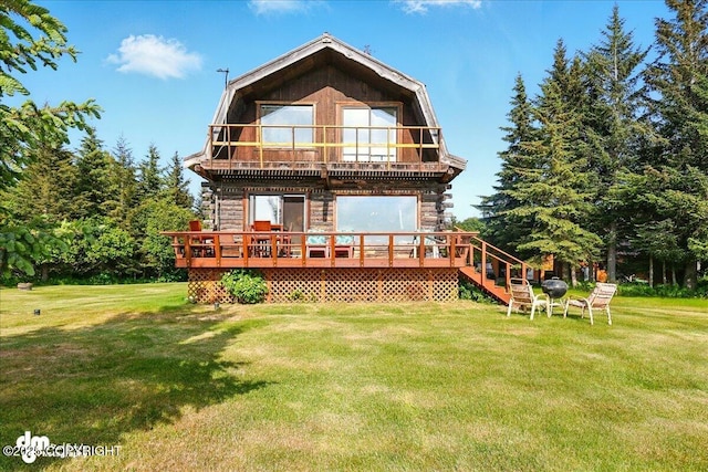 21033 Sterling Hwy, Ninilchik, AK 99639 - back of property featuring a balcony, a yard, and a wooden deck