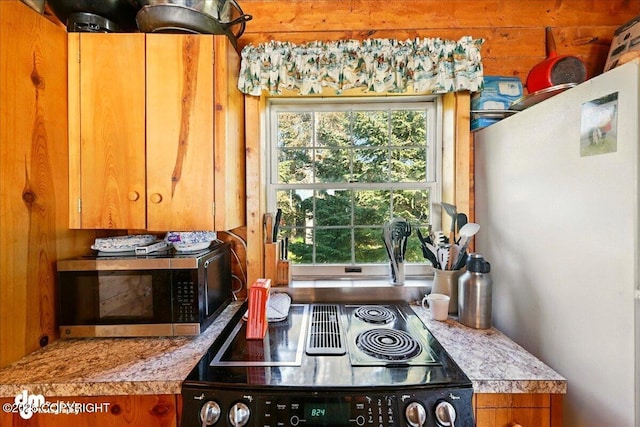 21033 Sterling Hwy, Ninilchik, AK 99639 - kitchen view of stainless steel appliances, brown cabinets, and light countertops