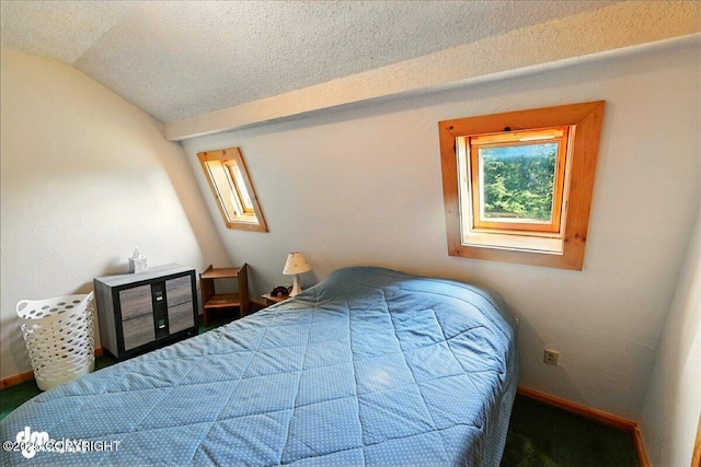 21033 Sterling Hwy, Ninilchik, AK 99639 - carpeted bedroom with vaulted ceiling and a textured ceiling