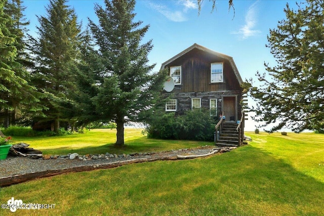 21033 Sterling Hwy, Ninilchik, AK 99639 - view of front facade with a gambrel roof, a front yard, and stairs