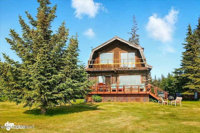 21033 Sterling Hwy, Ninilchik, AK 99639 - back of house featuring a balcony, a yard, and a wooden deck