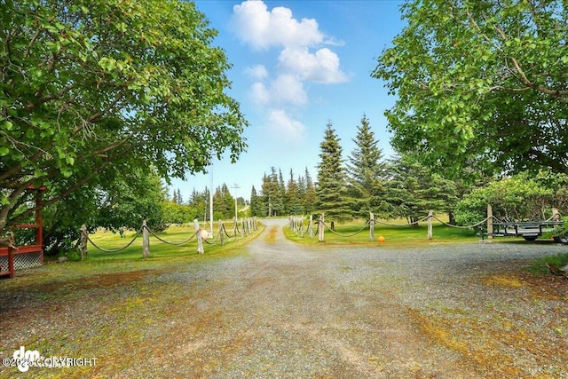21033 Sterling Hwy, Ninilchik, AK 99639 - view of dirt / gravel road featuring view of scattered trees