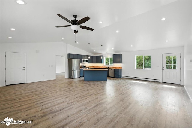 1380 N Cedar Hills Dr, Palmer, AK 99645 - unfurnished living room featuring a baseboard heating unit, a ceiling fan, light wood-style floors, recessed lighting, and high vaulted ceiling