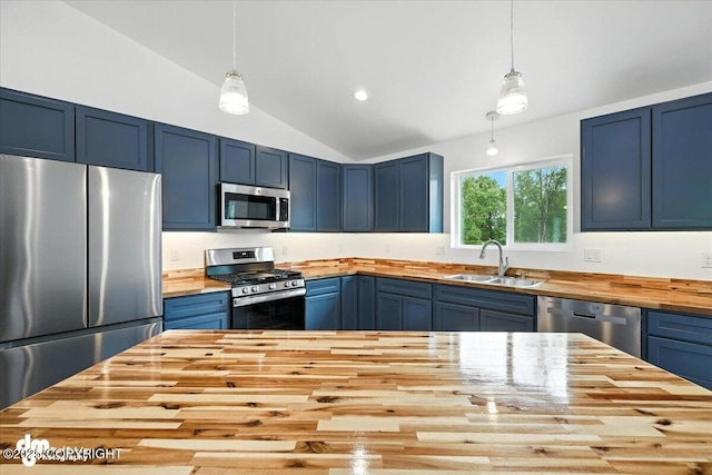 1380 N Cedar Hills Dr, Palmer, AK 99645 - kitchen featuring wood counters, appliances with stainless steel finishes, blue cabinets, lofted ceiling, and pendant lighting