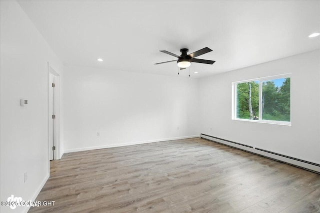 1380 N Cedar Hills Dr, Palmer, AK 99645 - empty room featuring a ceiling fan, wood finished floors, baseboard heating, and recessed lighting