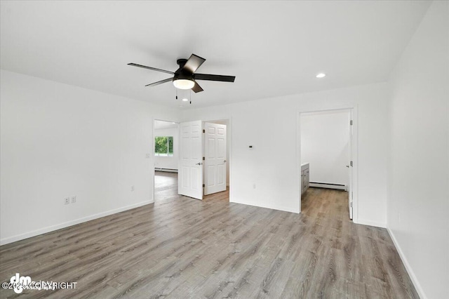 1380 N Cedar Hills Dr, Palmer, AK 99645 - empty room featuring baseboard heating, ceiling fan, wood finished floors, and recessed lighting