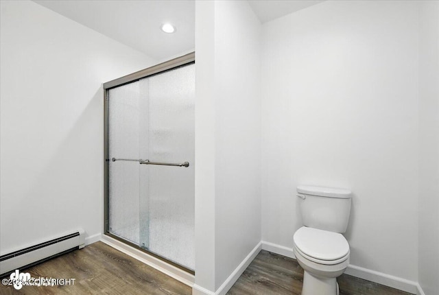 1380 N Cedar Hills Dr, Palmer, AK 99645 - bathroom featuring baseboard heating, wood finished floors, and a shower stall