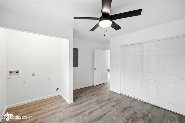 1380 N Cedar Hills Dr, Palmer, AK 99645 - unfurnished bedroom featuring wood finished floors, electric panel, a closet, and a ceiling fan