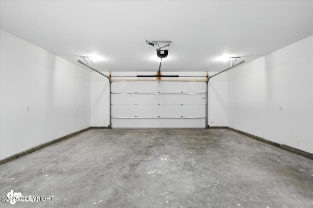 1380 N Cedar Hills Dr, Palmer, AK 99645 - garage featuring a garage door opener and baseboards