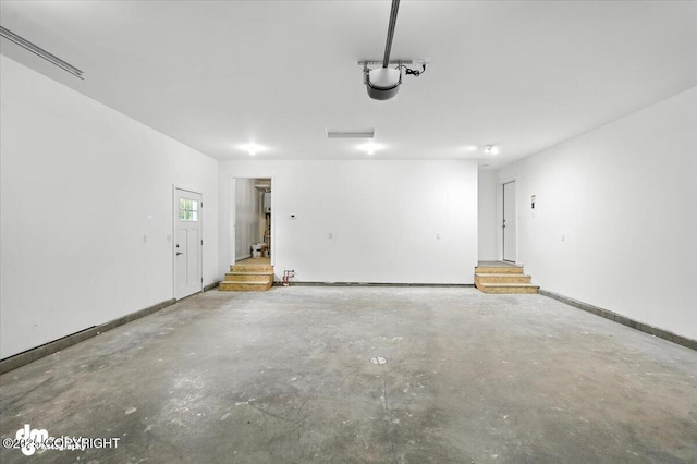 1380 N Cedar Hills Dr, Palmer, AK 99645 - garage featuring baseboards and a garage door opener