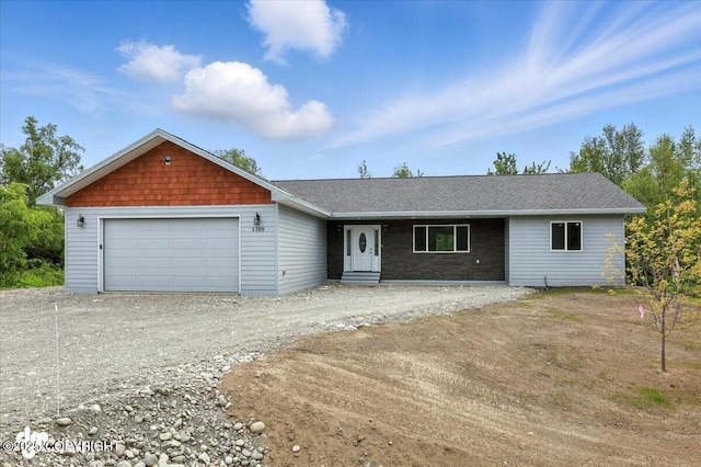 1380 N Cedar Hills Dr, Palmer, AK 99645 - view of front of house featuring a garage, driveway, and roof with shingles
