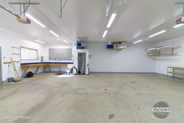 900 W Selina Ln, Wasilla, AK 99654 - garage with a workshop area and a garage door opener