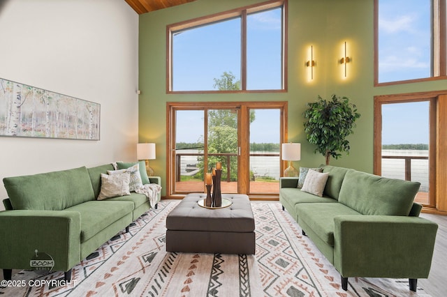 900 W Selina Ln, Wasilla, AK 99654 - living area with high vaulted ceiling, a water view, and healthy amount of natural light