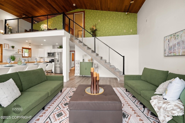 900 W Selina Ln, Wasilla, AK 99654 - living area featuring wood ceiling, high vaulted ceiling, stairs, light wood finished floors, and recessed lighting