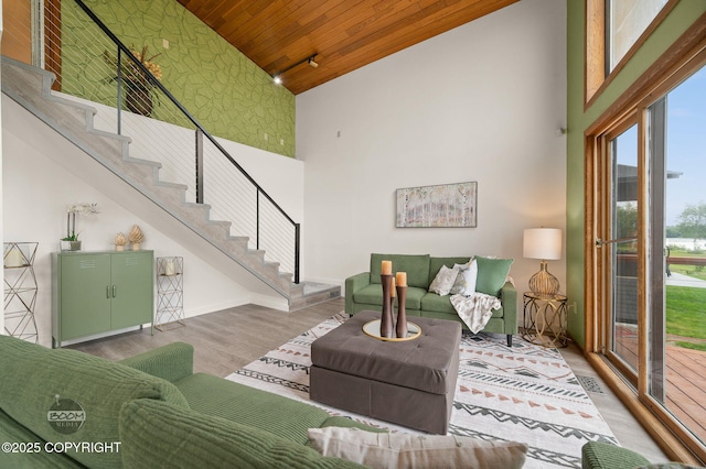 900 W Selina Ln, Wasilla, AK 99654 - living area featuring high vaulted ceiling, wood ceiling, stairway, and wood finished floors