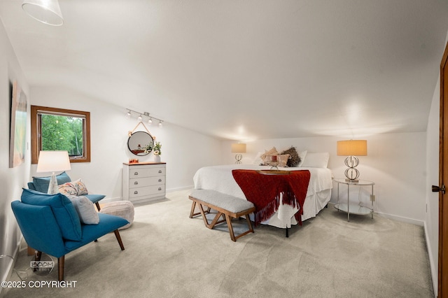 900 W Selina Ln, Wasilla, AK 99654 - bedroom with light carpet, vaulted ceiling, and track lighting