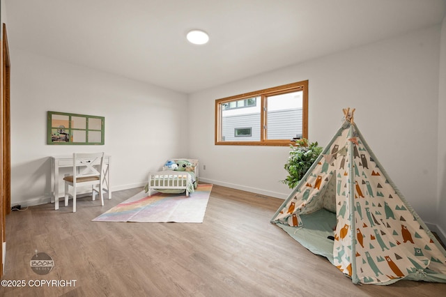 900 W Selina Ln, Wasilla, AK 99654 - bedroom featuring wood finished floors and baseboards