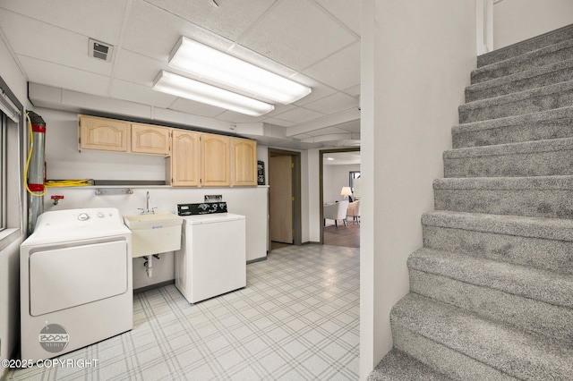 900 W Selina Ln, Wasilla, AK 99654 - washroom featuring cabinet space, independent washer and dryer, and light floors