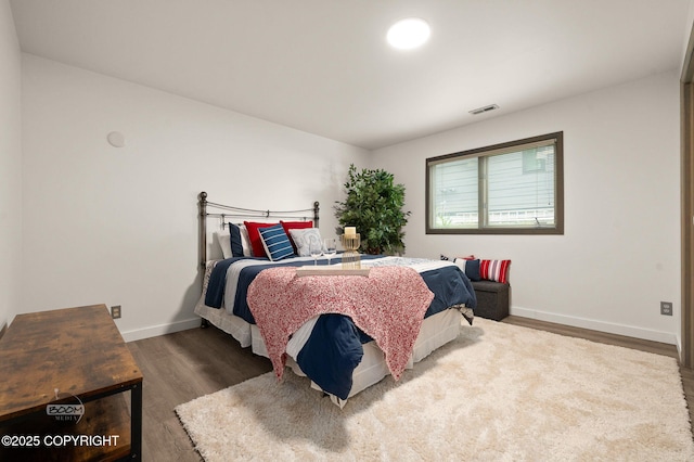 900 W Selina Ln, Wasilla, AK 99654 - bedroom featuring wood finished floors and baseboards