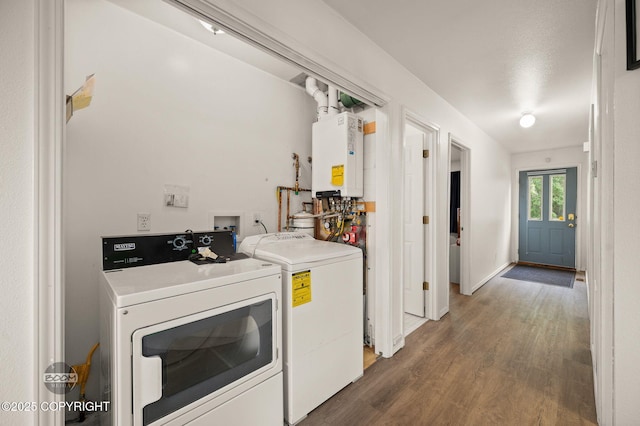 900 W Selina Ln, Wasilla, AK 99654 - washroom with washing machine and dryer, tankless water heater, and wood finished floors