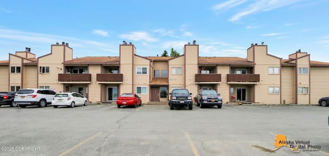 2210 Sentry Dr # B-18, Anchorage, AK 99507 - view of building exterior with uncovered parking