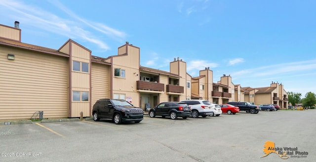 2210 Sentry Dr # B-18, Anchorage, AK 99507 - uncovered parking lot with a residential view