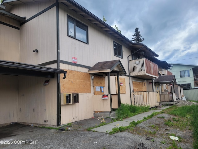 3802 Peterkin Ave, Anchorage, AK 99508 - rear view of house featuring a balcony