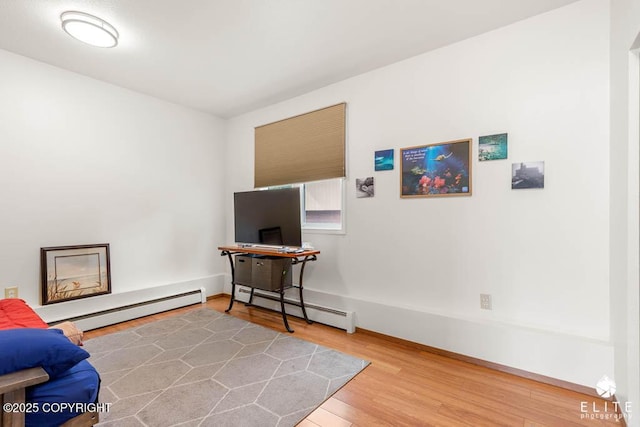 17311 Bonasila Cir, Eagle River, AK 99577 - living area with a baseboard radiator, wood finished floors, and baseboard heating