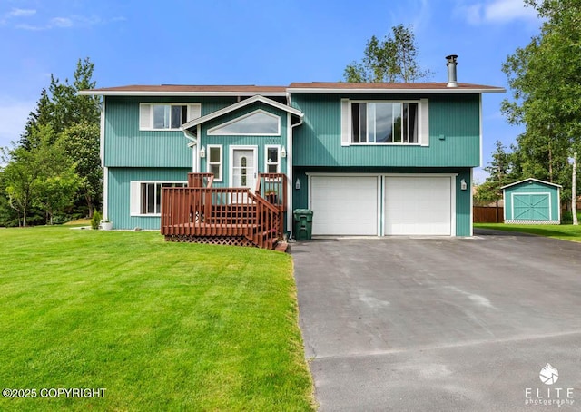 17311 Bonasila Cir, Eagle River, AK 99577 - split foyer home with a garage, a front yard, driveway, and an outbuilding