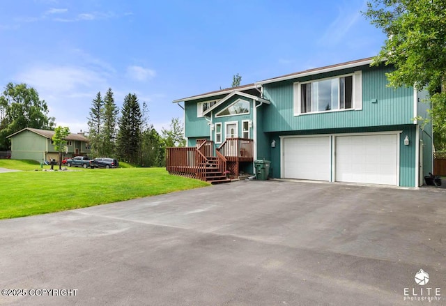 17311 Bonasila Cir, Eagle River, AK 99577 - bi-level home with asphalt driveway, an attached garage, and a front lawn