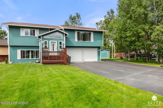 17311 Bonasila Cir, Eagle River, AK 99577 - bi-level home featuring a garage, driveway, and a front yard