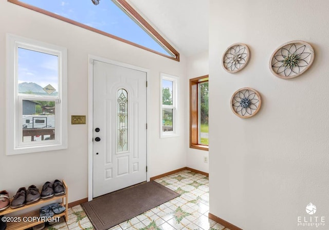 17311 Bonasila Cir, Eagle River, AK 99577 - foyer with healthy amount of natural light, light floors, and lofted ceiling