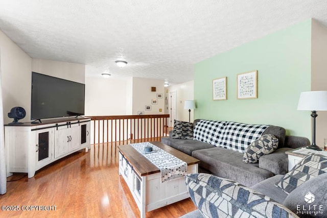17311 Bonasila Cir, Eagle River, AK 99577 - living area with wood-type flooring and a textured ceiling