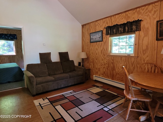 13925 Ravenquest Ave, Seward, AK 99664 - living area with healthy amount of natural light, wood finished floors, wooden walls, and high vaulted ceiling