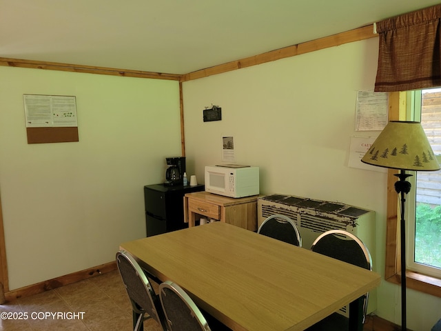 13925 Ravenquest Ave, Seward, AK 99664 - tiled dining room with baseboards