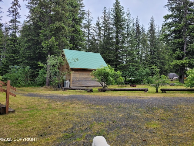 13925 Ravenquest Ave, Seward, AK 99664 - view of grassy yard with a wooded view