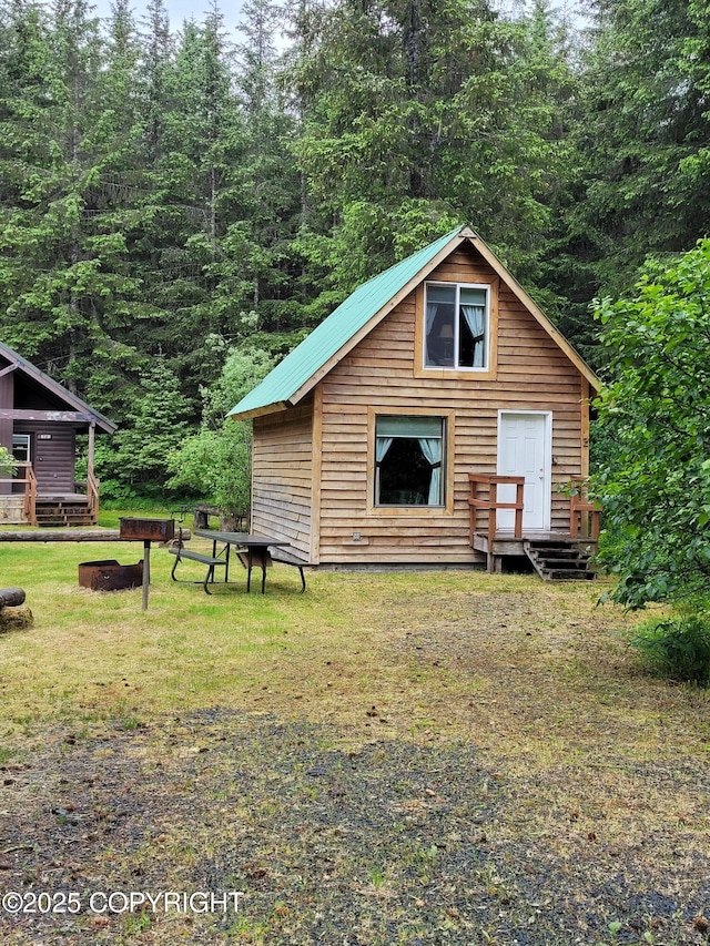 13925 Ravenquest Ave, Seward, AK 99664 - view of outbuilding featuring a view of trees