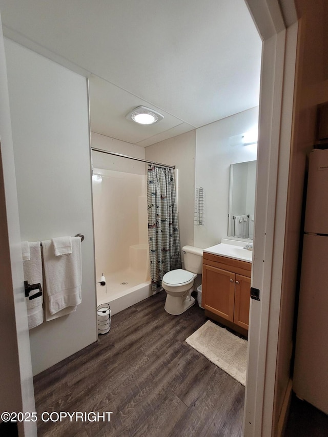 13925 Ravenquest Ave, Seward, AK 99664 - full bathroom featuring wood finished floors, vanity, and a stall shower
