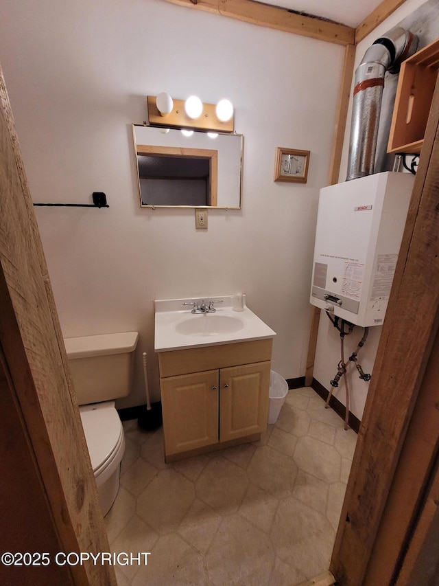 13925 Ravenquest Ave, Seward, AK 99664 - bathroom featuring vanity, tile patterned floors, and water heater