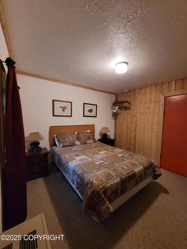 13925 Ravenquest Ave, Seward, AK 99664 - bedroom with carpet floors, wooden walls, and a textured ceiling