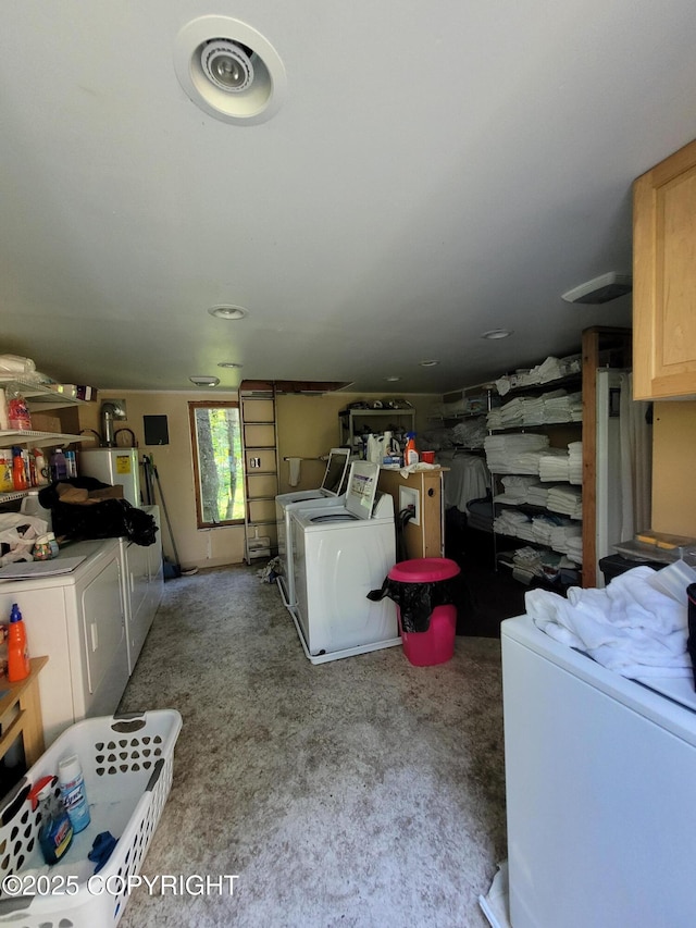 13925 Ravenquest Ave, Seward, AK 99664 - below grade area featuring washing machine and clothes dryer, carpet, and water heater