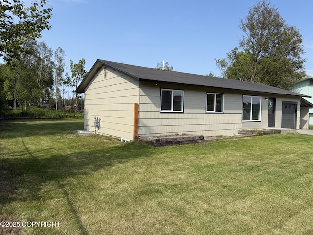 1510 Fathom Dr, Kenai, AK 99611 - view of property exterior with a lawn and a garage