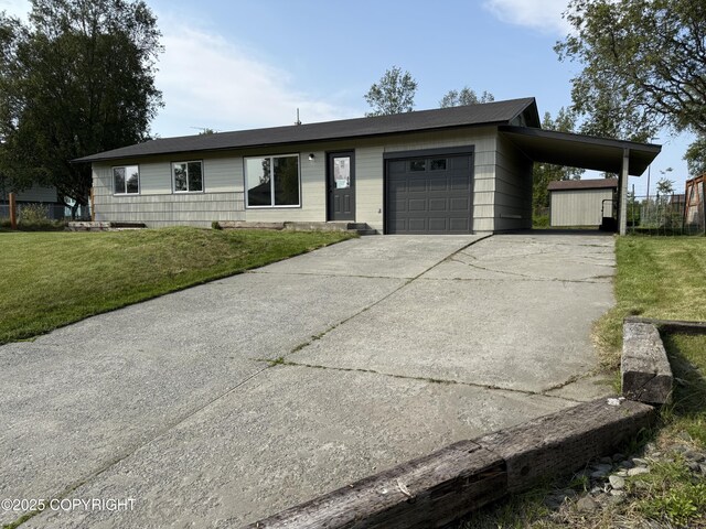 1510 Fathom Dr, Kenai, AK 99611 - ranch-style home with a front yard, a carport, concrete driveway, and a garage