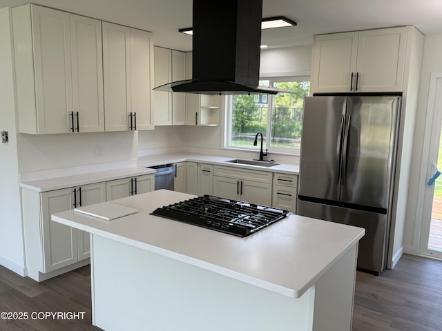 1510 Fathom Dr, Kenai, AK 99611 - kitchen with stainless steel appliances, ventilation hood, wood finished floors, and a center island