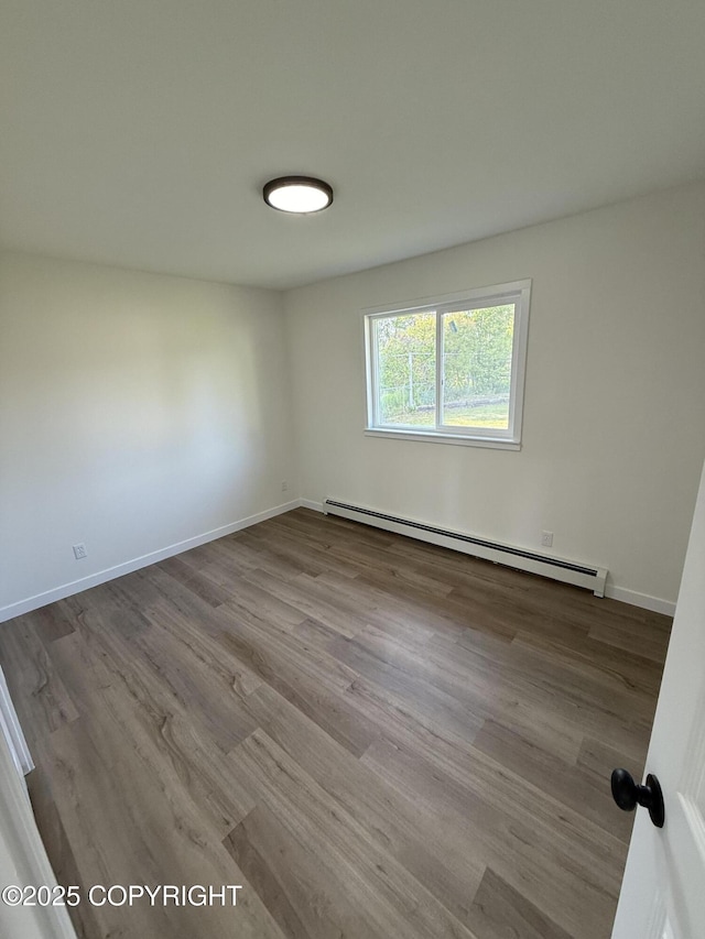 1510 Fathom Dr, Kenai, AK 99611 - unfurnished room with a baseboard radiator and wood finished floors