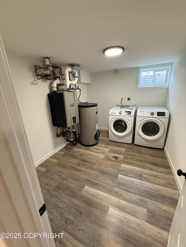 1510 Fathom Dr, Kenai, AK 99611 - laundry area featuring water heater, washer and clothes dryer, and wood finished floors