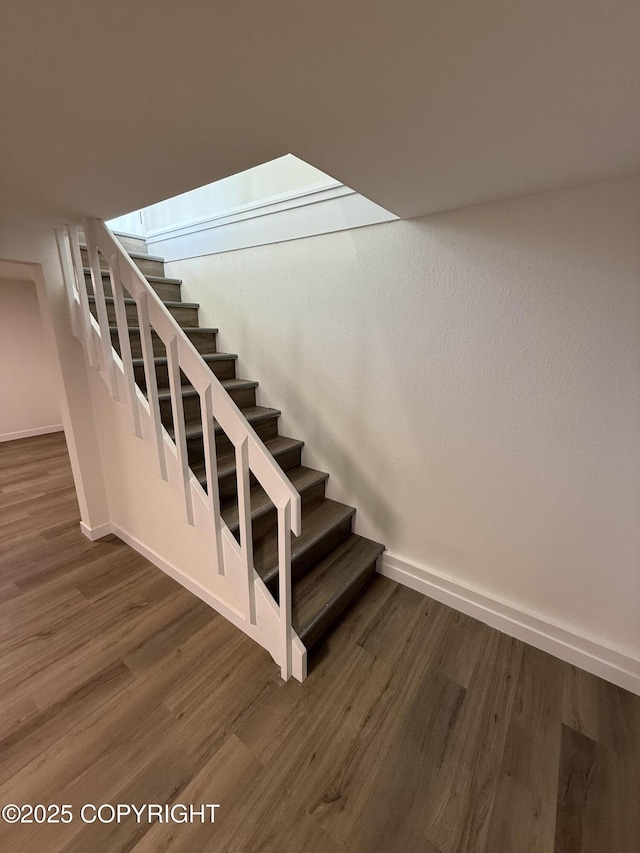 1510 Fathom Dr, Kenai, AK 99611 - staircase featuring wood finished floors and baseboards